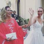 Romina Power, abito rosso alle nozze di Cristel: la stilista è...
